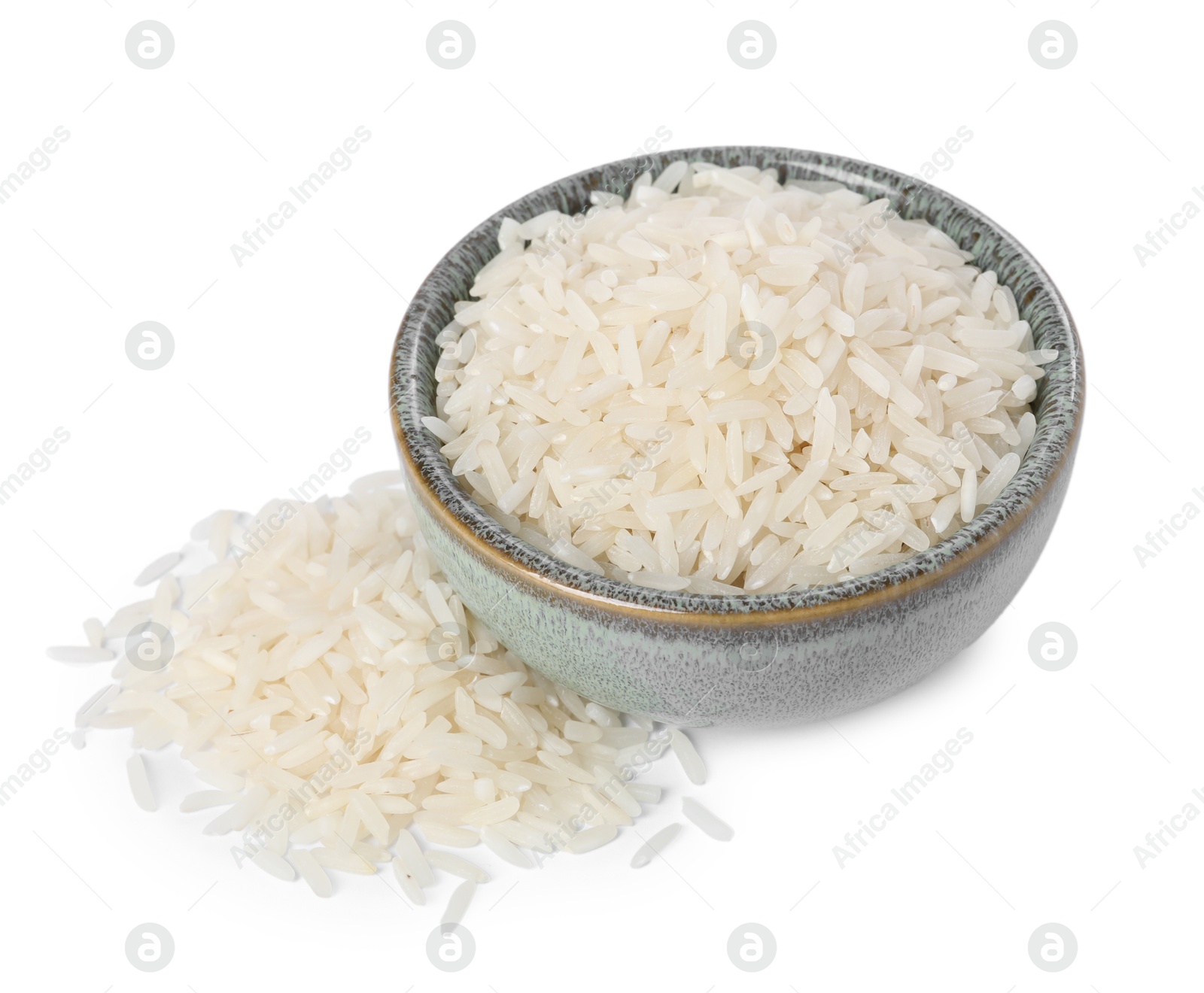 Photo of Raw rice in bowl isolated on white