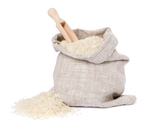 Raw rice and scoop in sack isolated on white