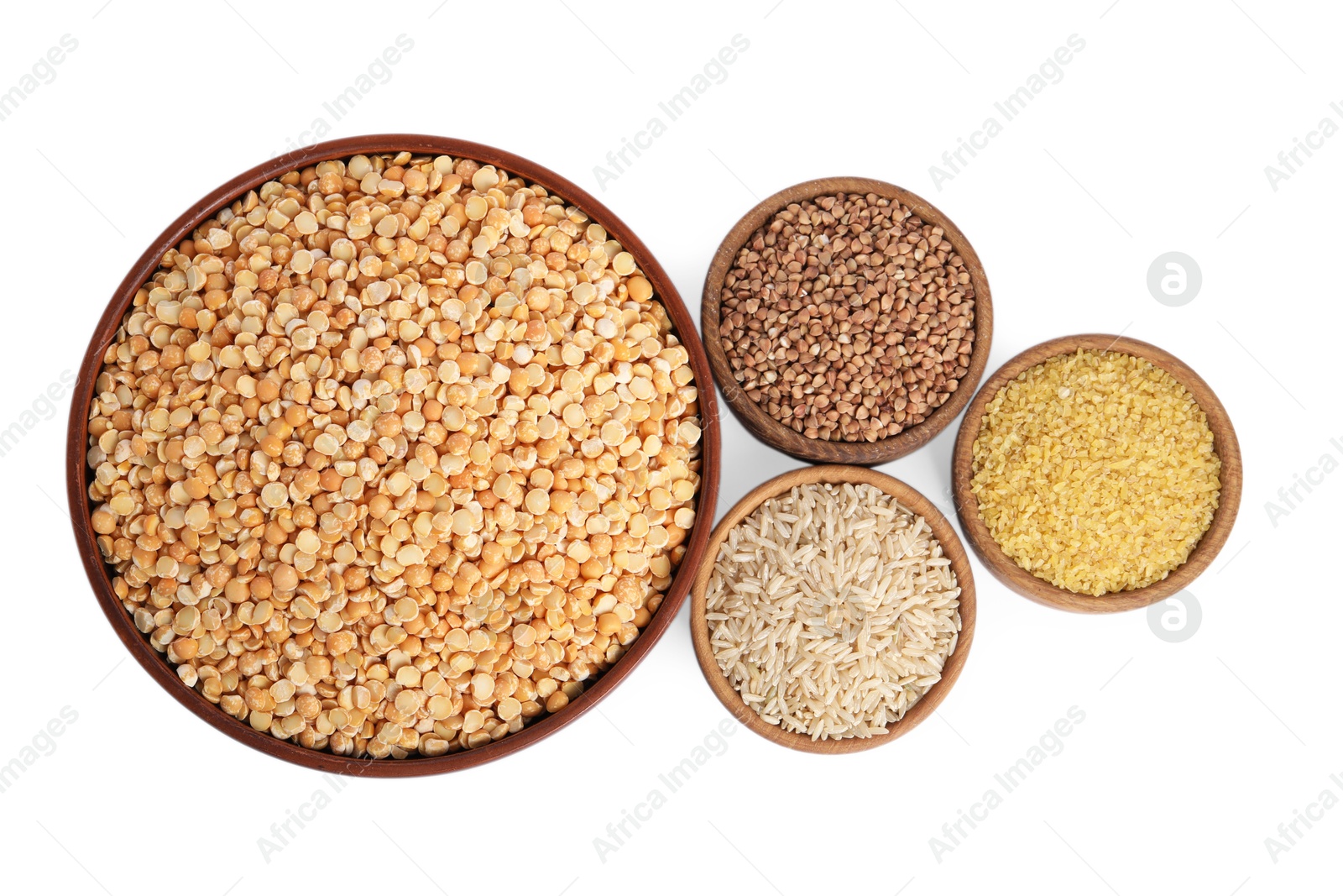 Photo of Different cereals and peas in bowls isolated on white, top view