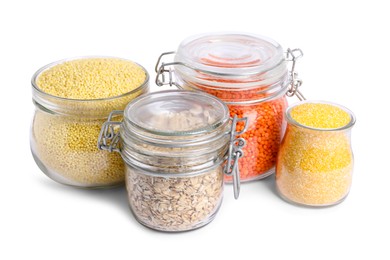 Different cereals and lentils in jars isolated on white