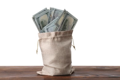 Photo of Dollar banknotes in bag on wooden table against white background