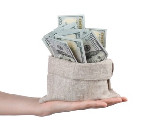 Photo of Woman with bag of dollar banknotes against light background, closeup