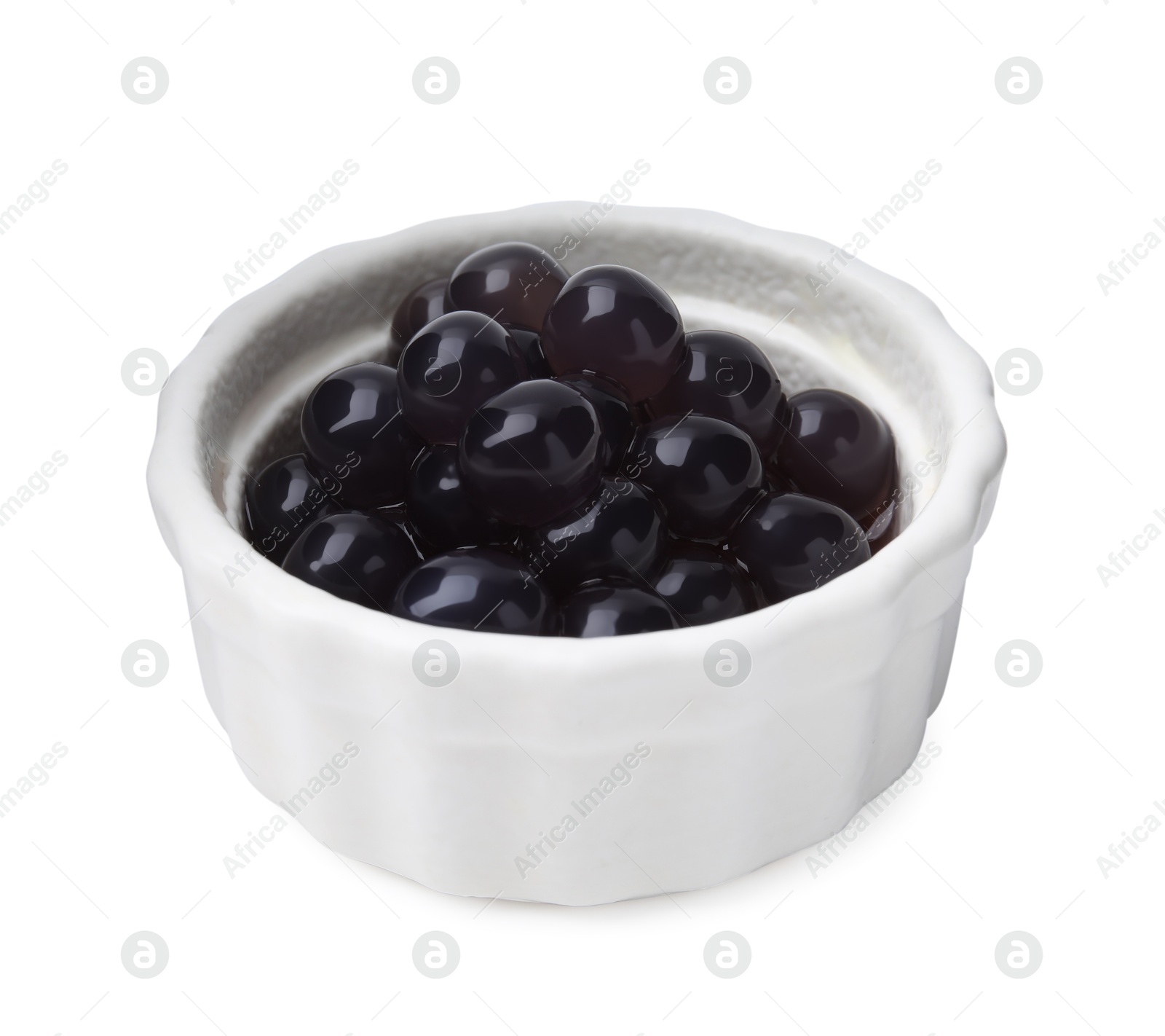 Photo of Dark tapioca pearls in bowl isolated on white