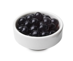 Photo of Dark tapioca pearls in bowl isolated on white