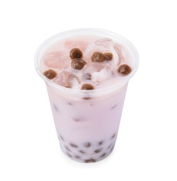 Photo of Tasty milk bubble tea in plastic cup isolated on white