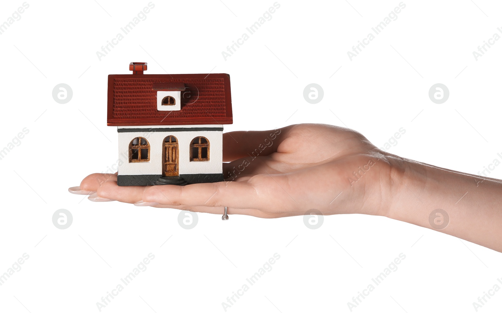 Photo of Woman holding house model on white background, closeup