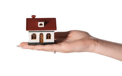 Photo of Woman holding house model on white background, closeup