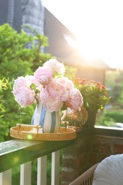 Balcony garden. Beautiful flowers on railings outdoors