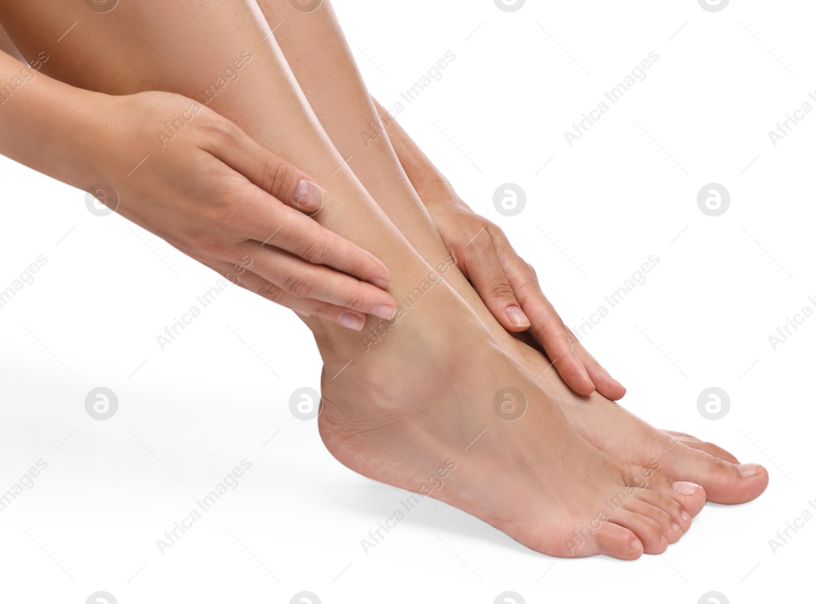 Photo of Woman touching her smooth feet on white background, closeup