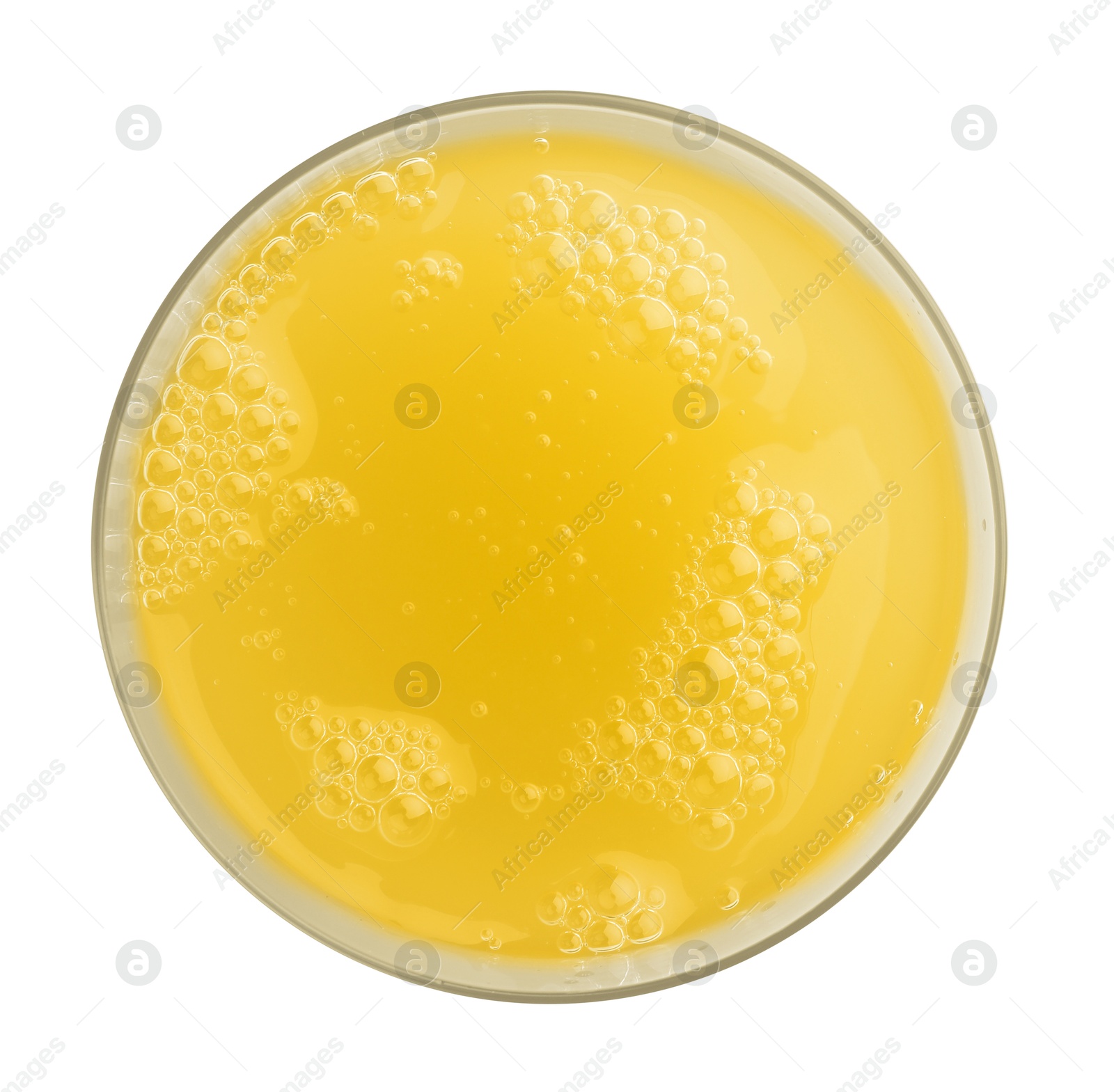 Photo of Tasty pineapple juice in glass isolated on white, top view