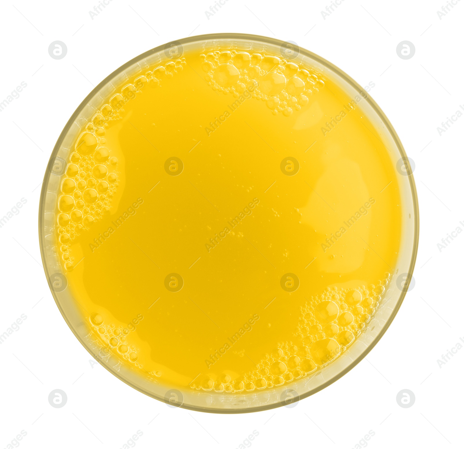 Photo of Tasty pineapple juice in glass isolated on white, top view