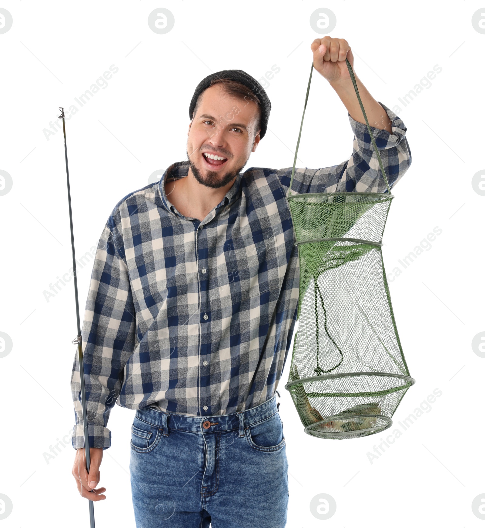 Photo of Smiling fisherman with rod and caught fish in net isolated on white