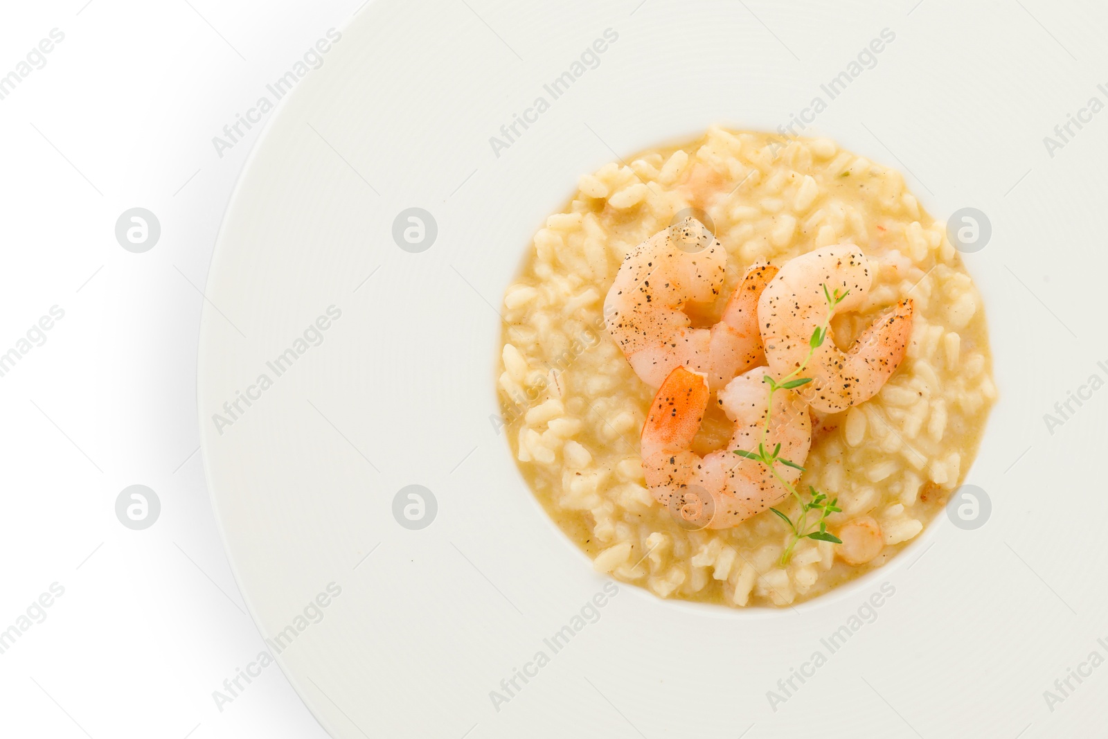 Photo of Delicious risotto with shrimps and cheese isolated on white, top view