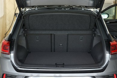 Photo of Grey soft car boot liner mat in trunk of auto