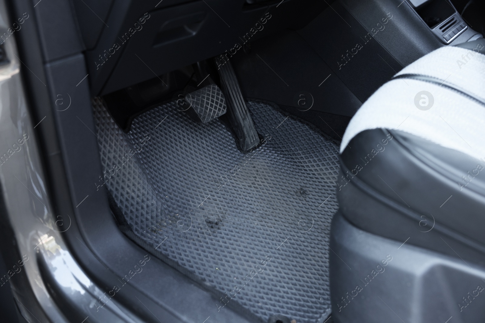 Photo of Grey rubber car floor mat in auto