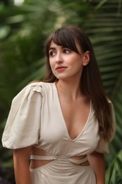 Photo of Portrait of beautiful woman in tropical forest