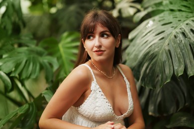 Photo of Portrait of beautiful woman in tropical forest