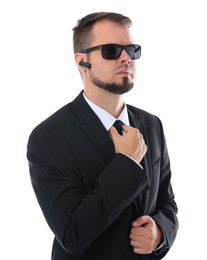 Photo of Young bodyguard in suit and sunglasses isolated on white