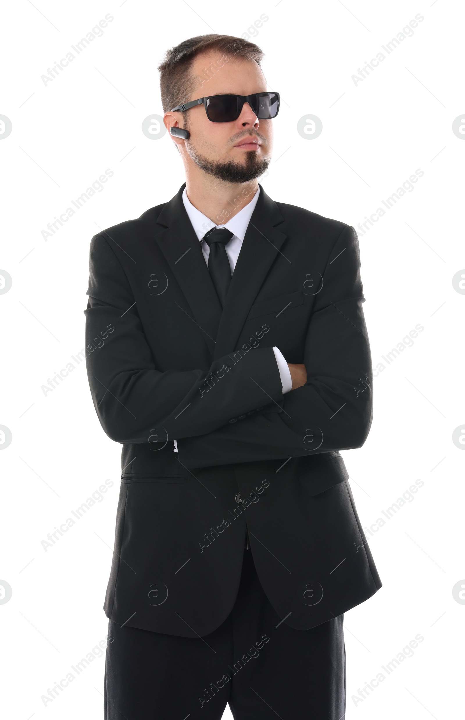 Photo of Young bodyguard in suit and sunglasses isolated on white