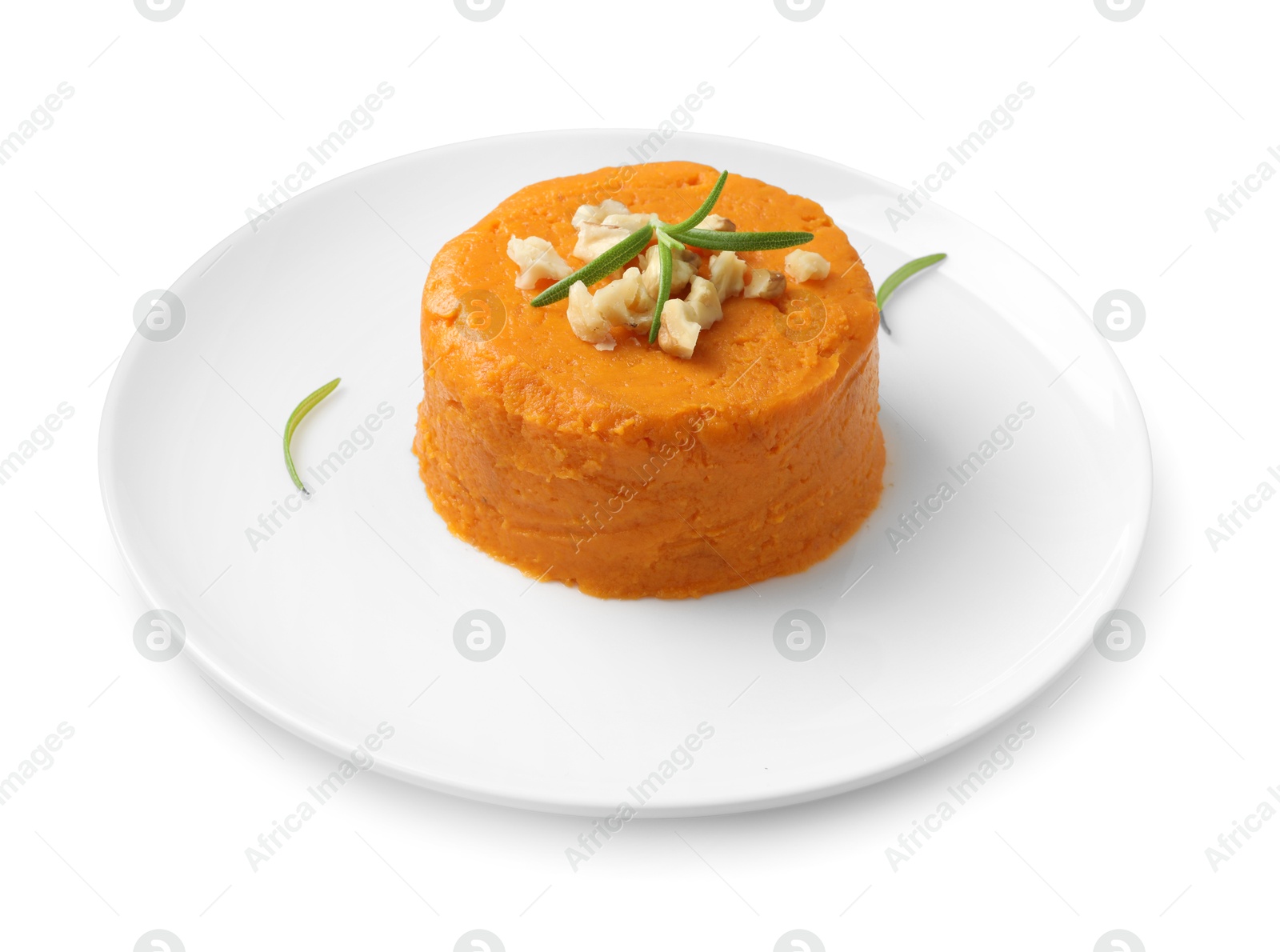 Photo of Plate with tasty mashed sweet potato, rosemary and walnuts isolated on white