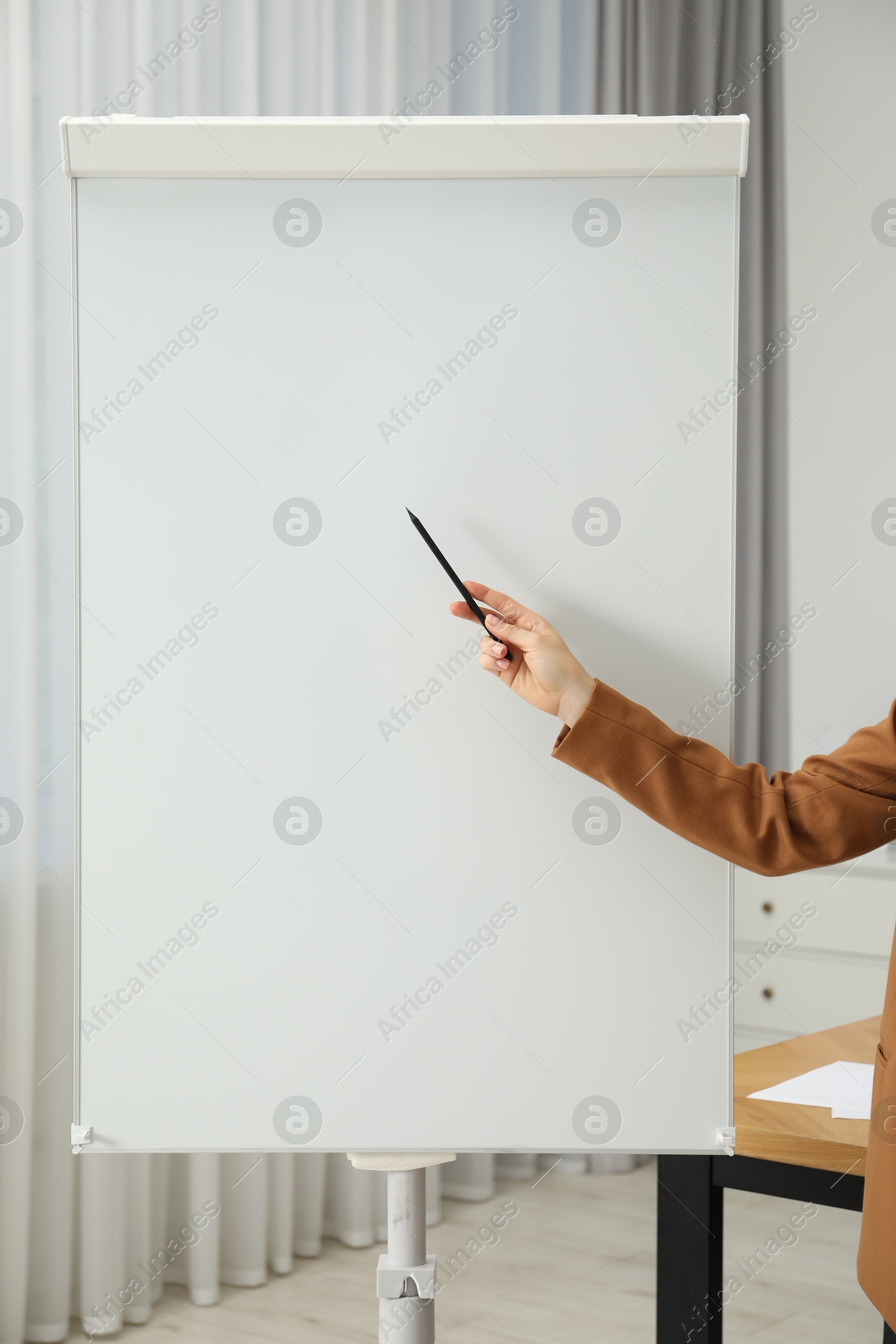 Photo of Woman near flip chart in office, closeup. Mockup for design