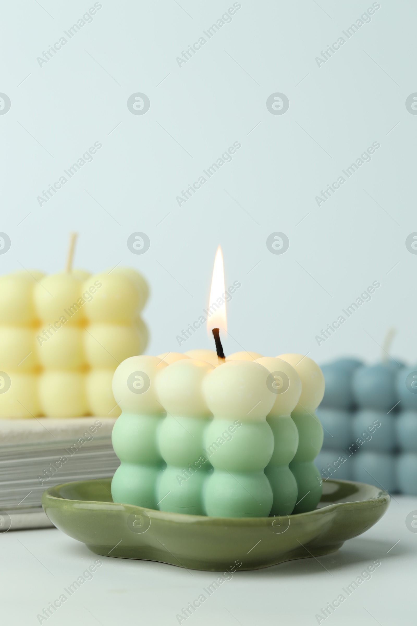 Photo of Beautiful bubble candles on light background, closeup