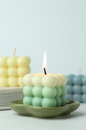 Photo of Beautiful bubble candles on light background, closeup