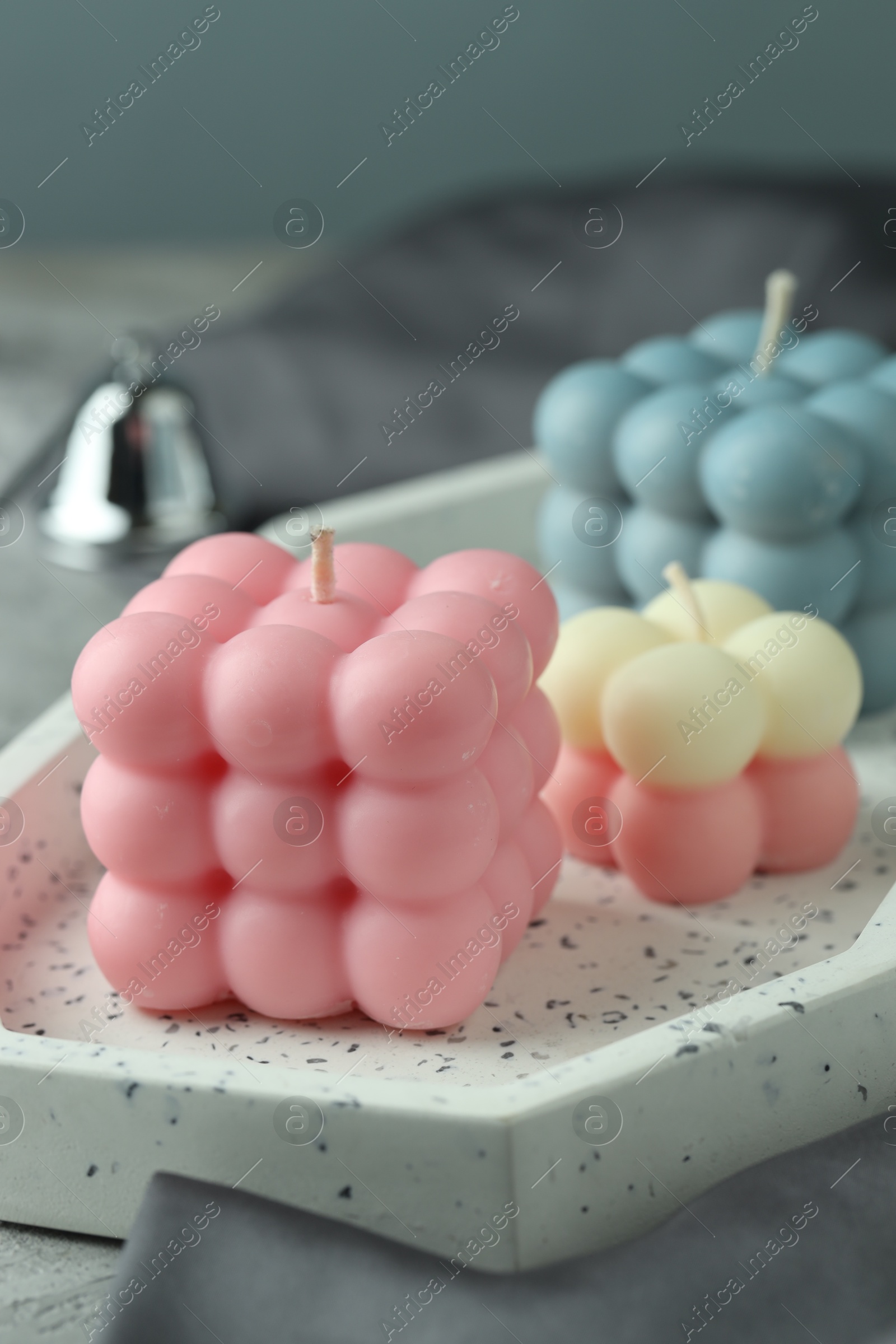 Photo of Three beautiful bubble candles on table, closeup