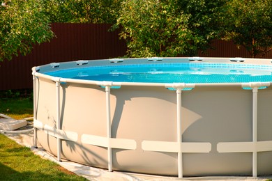 Photo of Above ground swimming pool outdoors on sunny day