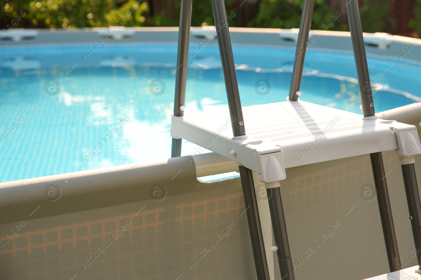 Photo of Above ground swimming pool outdoors on sunny day, closeup