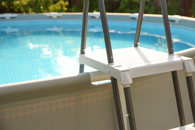 Above ground swimming pool outdoors on sunny day, closeup