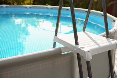 Photo of Above ground swimming pool outdoors on sunny day, closeup