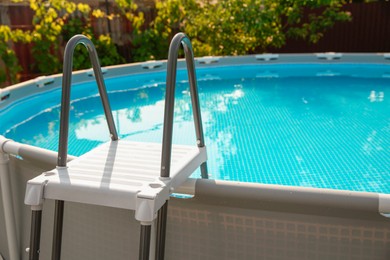 Photo of Above ground swimming pool outdoors on sunny day, closeup