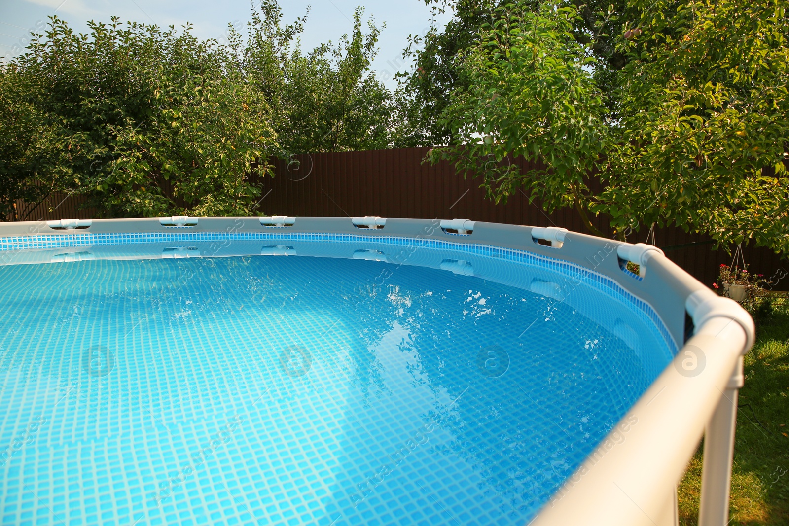 Photo of Above ground swimming pool outdoors on sunny day, closeup