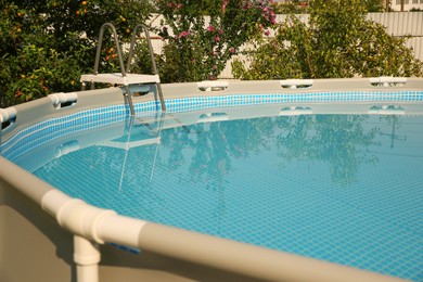 Photo of Above ground swimming pool outdoors on sunny day, closeup