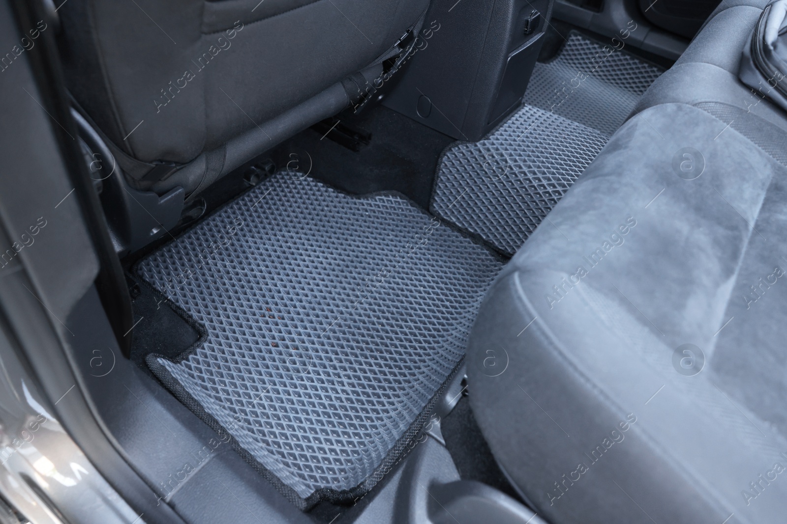 Photo of Grey rubber car floor mats in auto