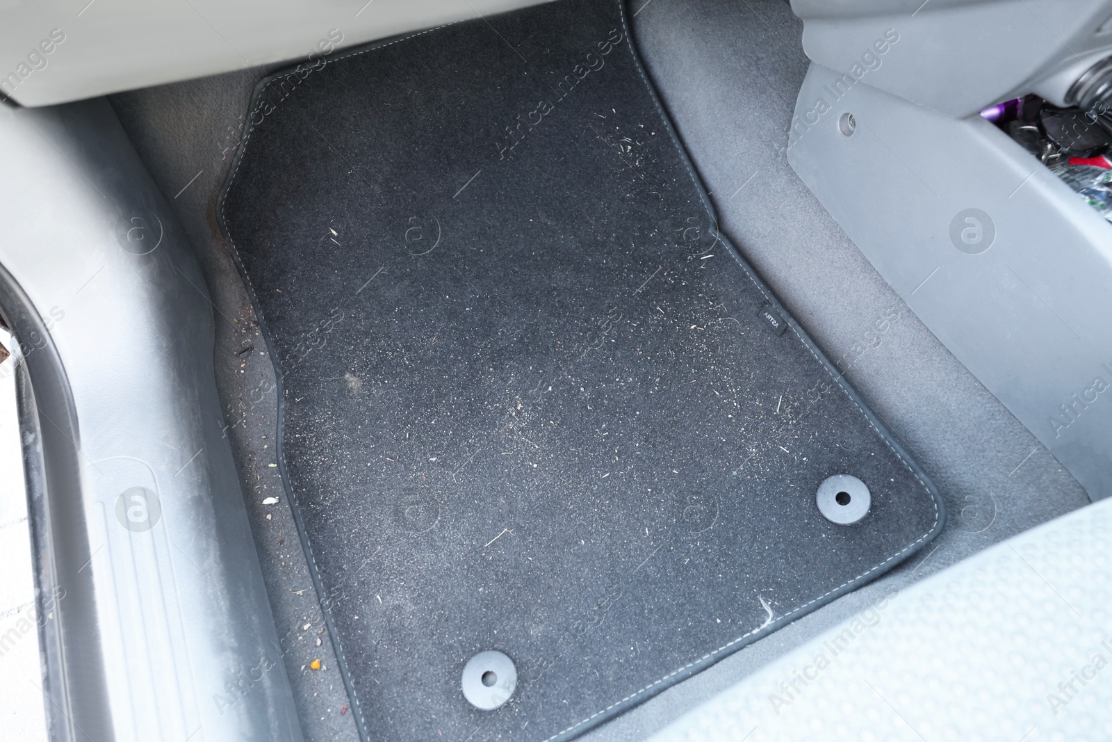 Photo of Black soft car floor mat in auto