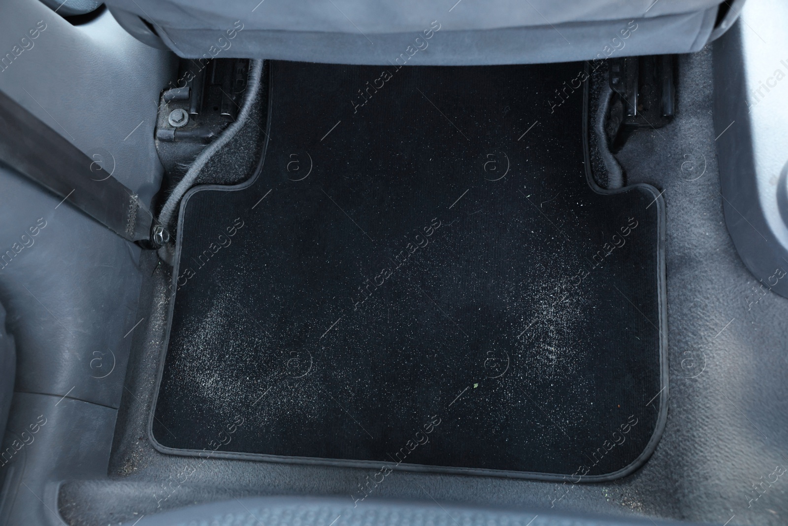 Photo of Black soft car floor mat in auto, above view