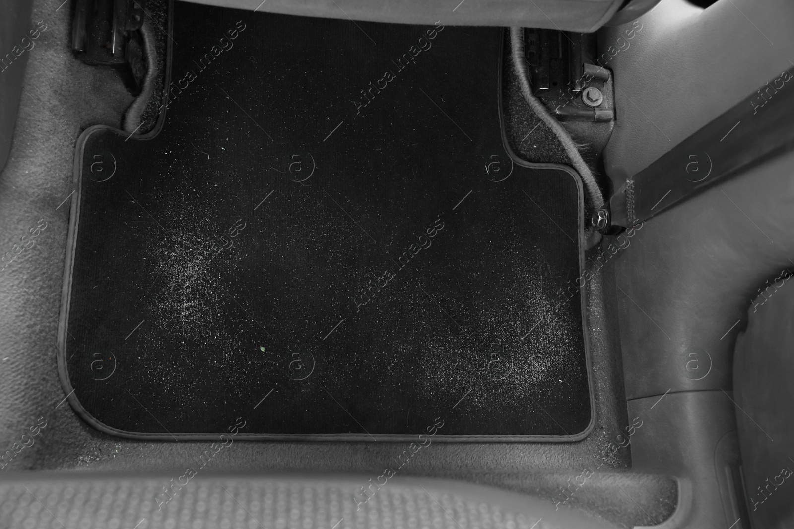 Photo of Black soft car floor mat in auto, above view