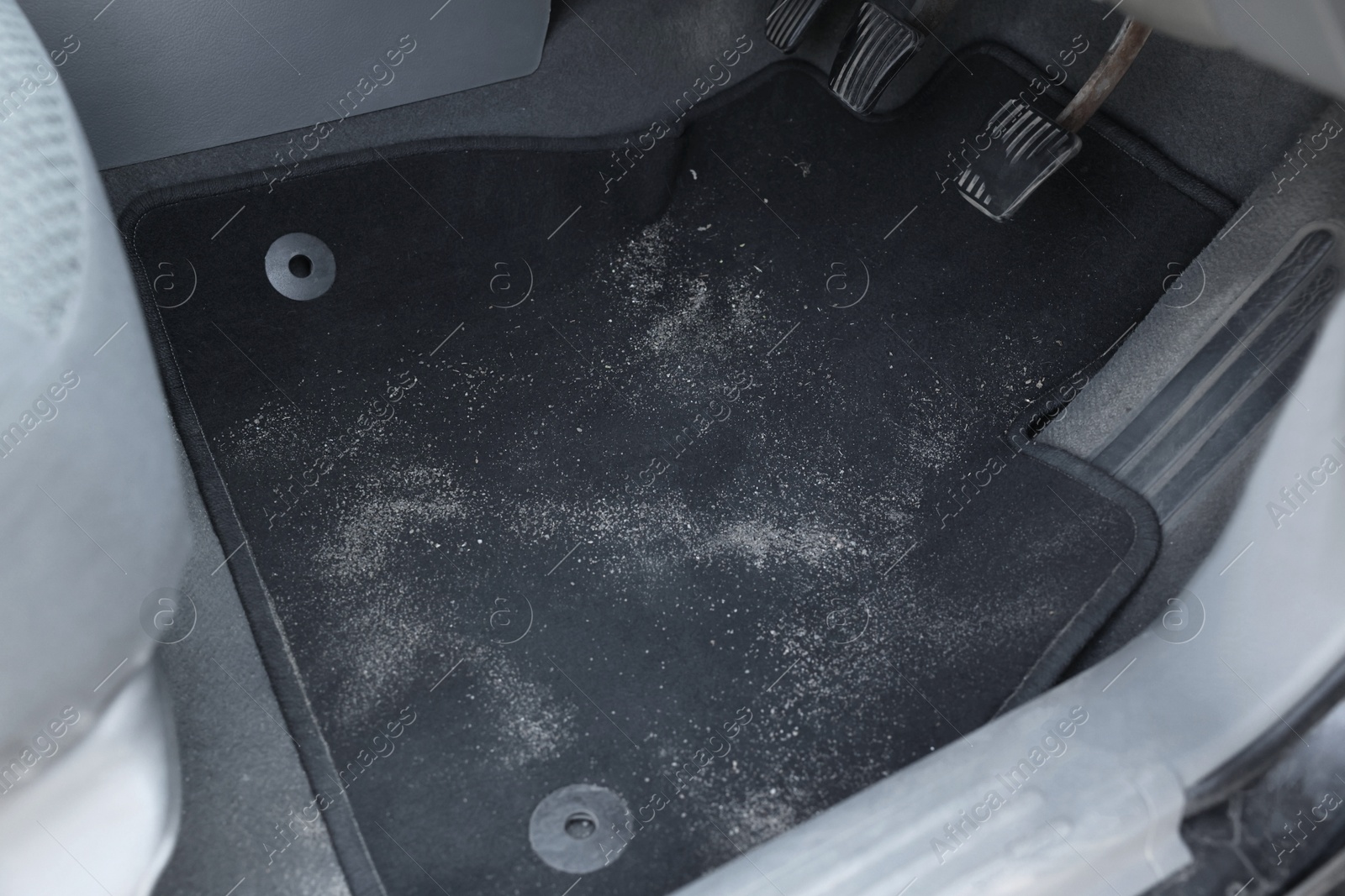 Photo of Black soft car floor mat in auto