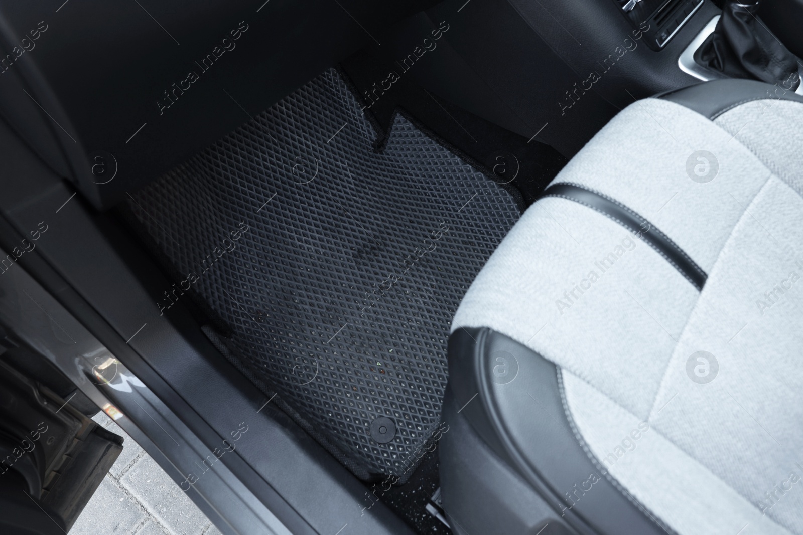 Photo of Grey rubber car floor mat in auto