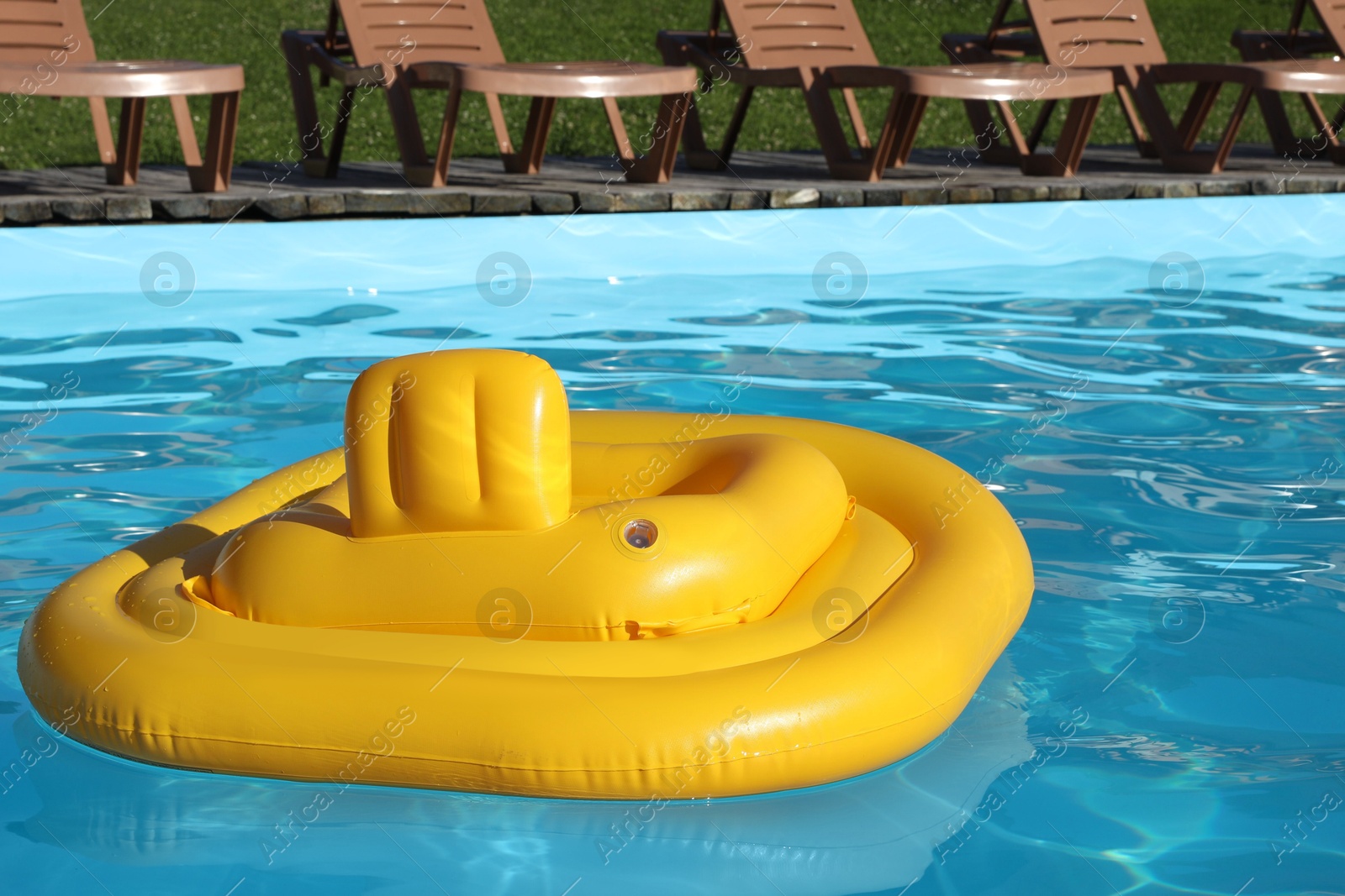 Photo of Yellow float in swimming pool at luxury resort