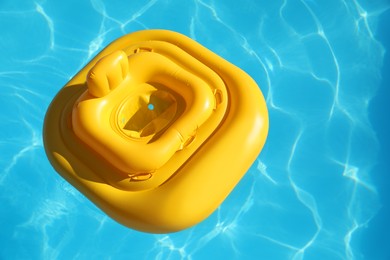 Yellow float in swimming pool at luxury resort