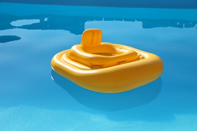 Yellow float in swimming pool at luxury resort