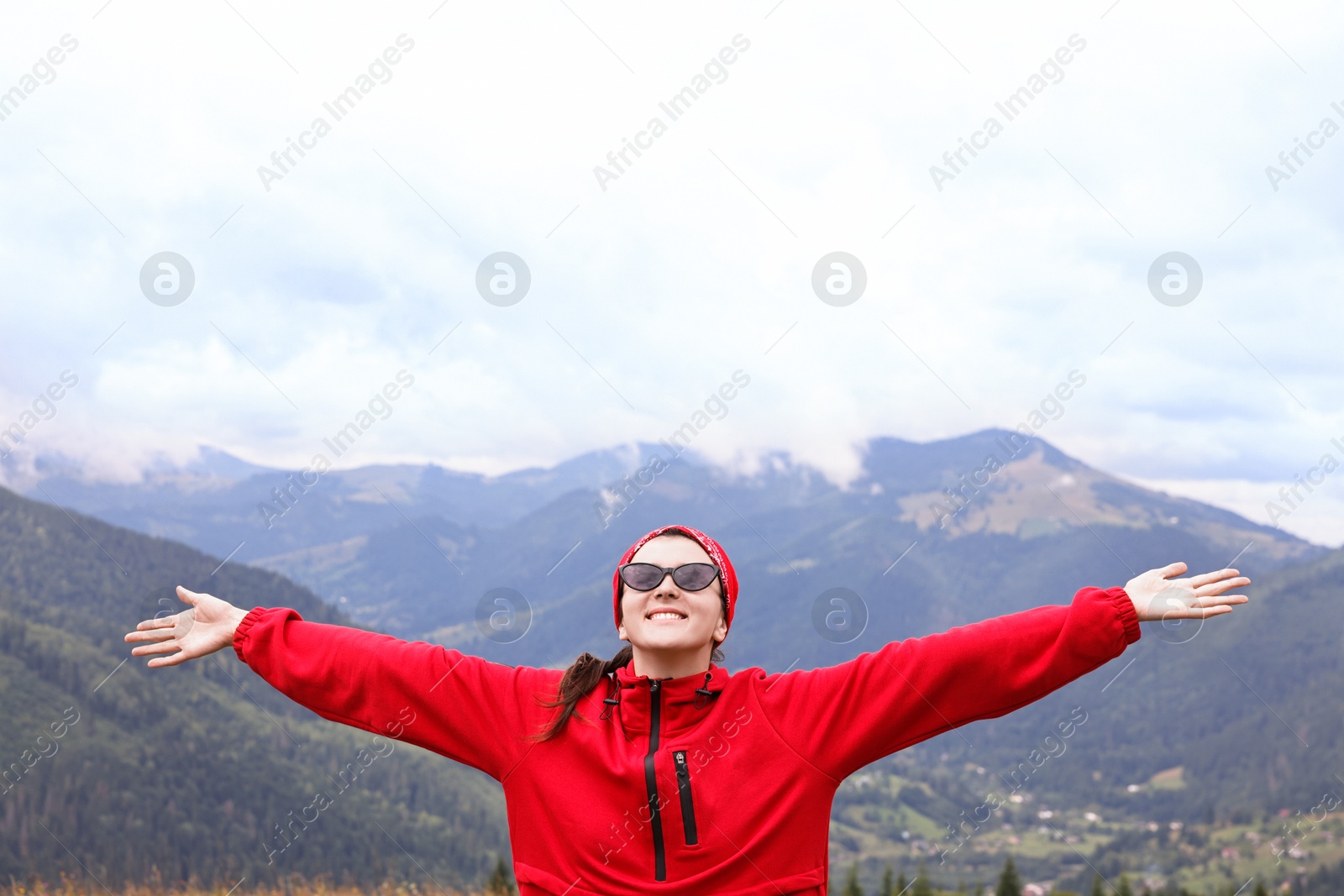 Photo of Happy young hiker in mountains. Active tourism