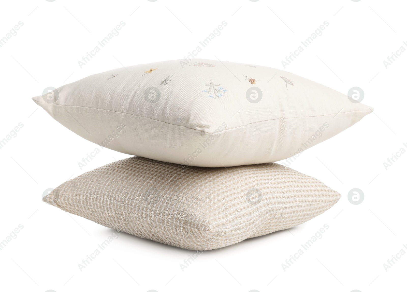 Photo of Stack of different pillows isolated on white