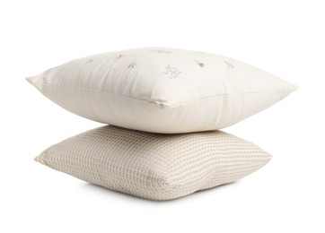 Photo of Stack of different pillows isolated on white