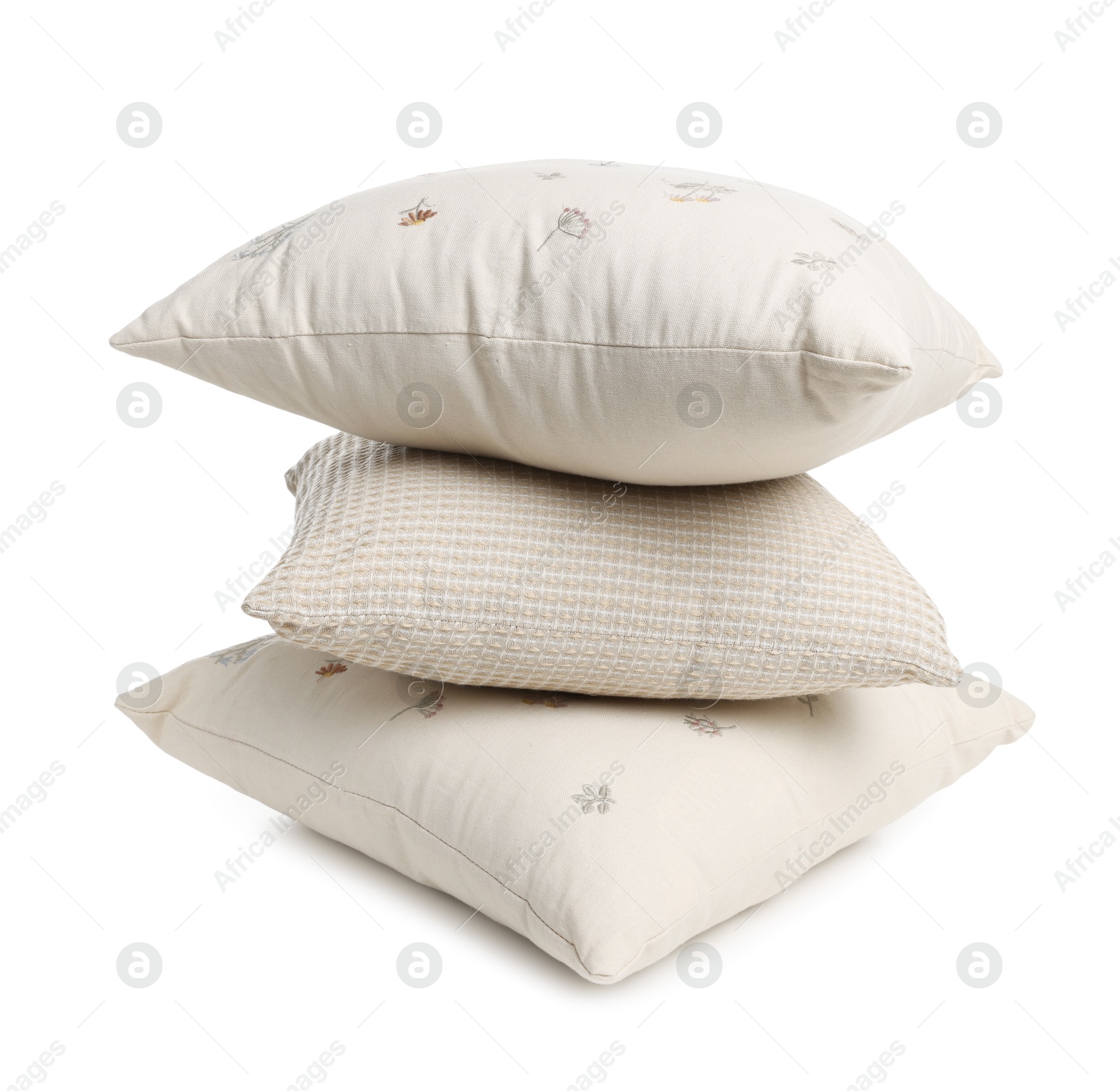 Photo of Stack of different pillows isolated on white