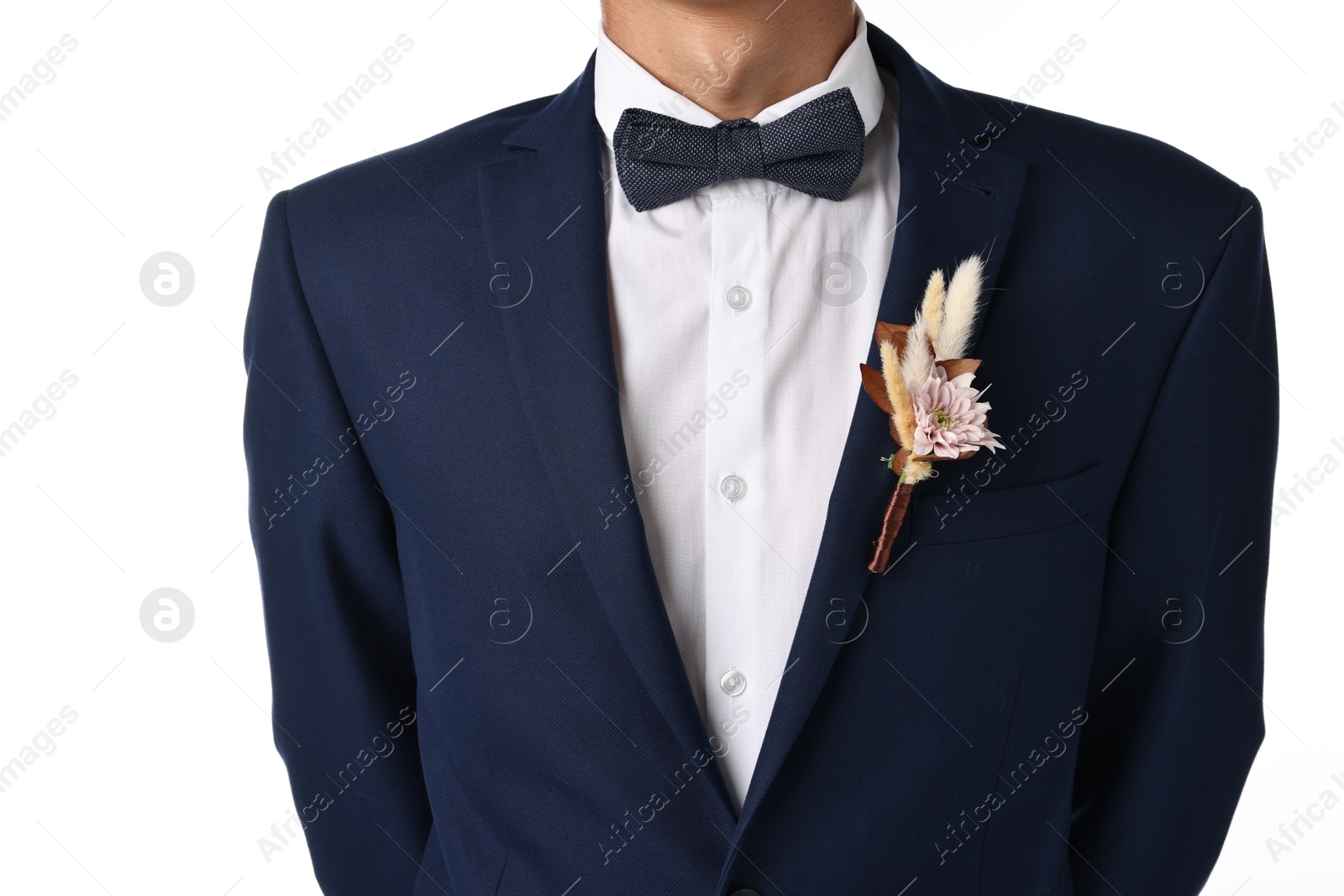 Photo of Groom in suit with stylish boutonniere on white background, closeup