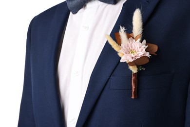 Photo of Groom in suit with stylish boutonniere on white background, closeup